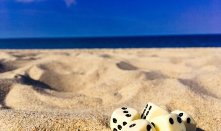 five dice on sand